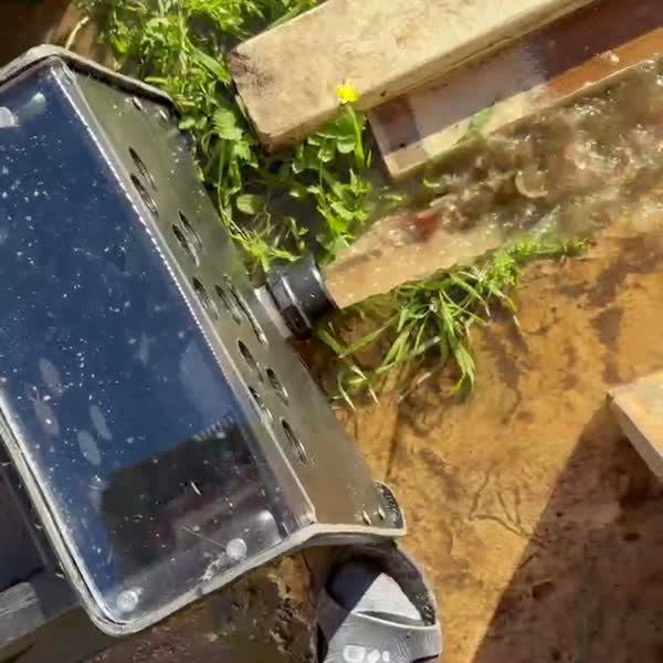 The far end of the trough where dirty water drains out